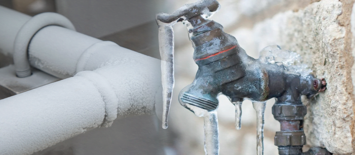 Frozen water pipes and tapes covered with ice